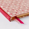 Good Juju Ink Pink Folk Pattern Pocket Journal (1 pc) - Satin bookmarks highlighted. 