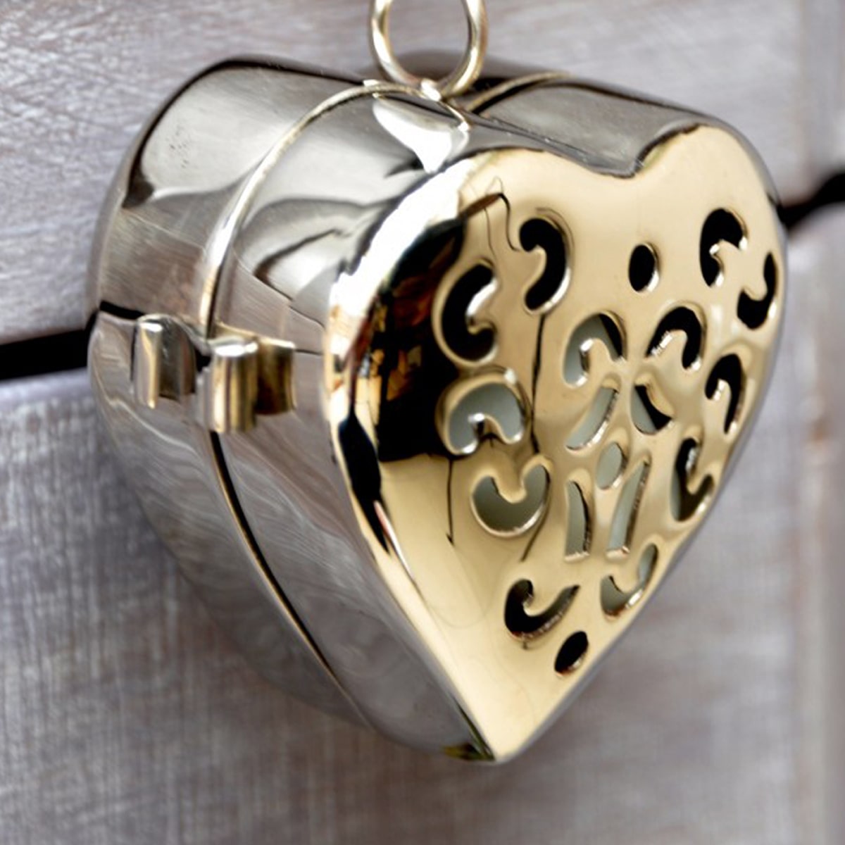 Autour Du Parfum Little Heart of Amber Mystery Solid Perfume ( 1 pc) - product shown close up on wood. 