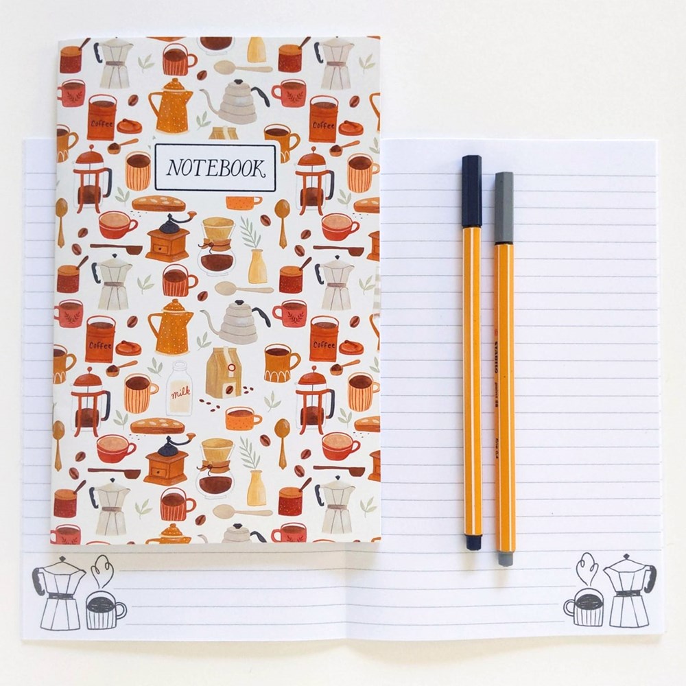 Julianna Swaney Coffee Time Notebook (1 pc) cover, shown also with another notebook shown open, with two pens. Notebooks sold individually, pens not included.

