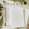 Emily Lex Studio Mushrooms Paintable Notecards (8 pcs) - product shown with paintbrush and fern leaves. 