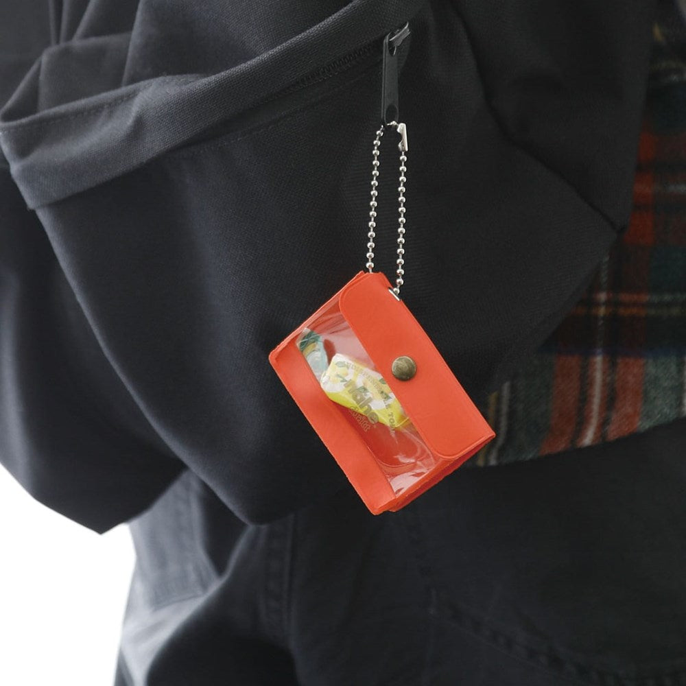 Nähe Mini General Purpose Case - Red (1 pc) - product shown being used hanging from backpack. 