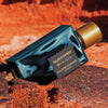 Goldfield & Banks Tales of Amber Extrait de Parfum (100 ml) on a red rock background