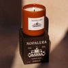 Lifestyle shot of Nopalera Chocolate Ibarra Candle (8.5 oz) with box and candle burning