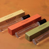 Nopalera Travel Fragrance Trio (3 x 10 ml) with their respective boxes on an orange background