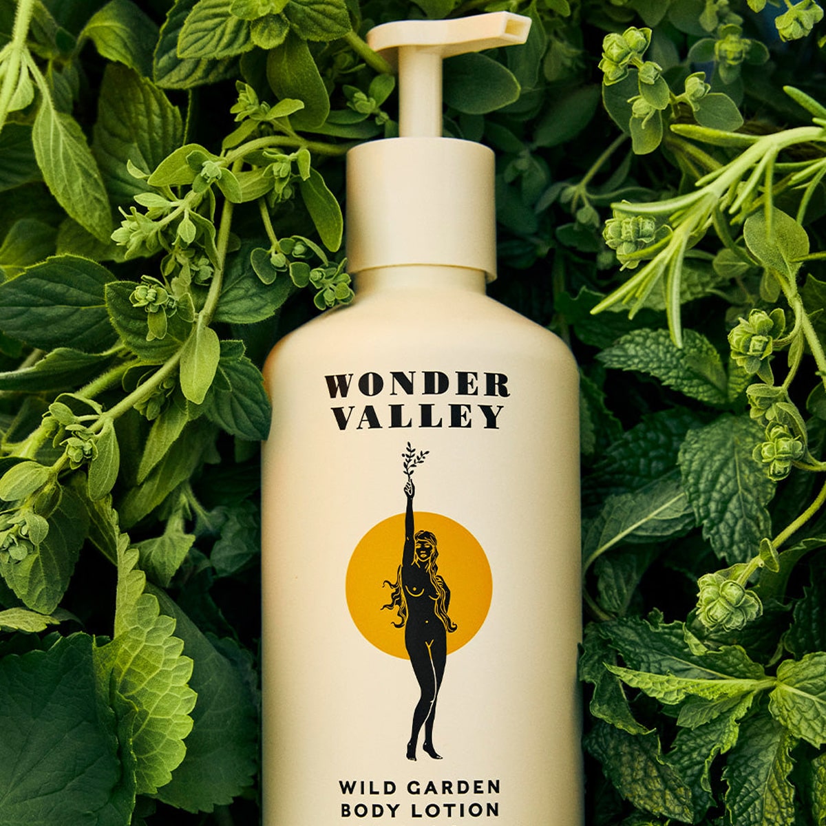 Wonder Valley Wild Garden Body Lotion (300 ml) surrounded by mint leaves