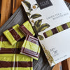 Eclat Chocolate Green Tea & Roasted Rice Chocolate Bar (2.2 oz) on a wooden surface