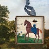 Maris Mirum Small Locket - Riding Day (1 pc) on a blurred natural background showing trees and sky