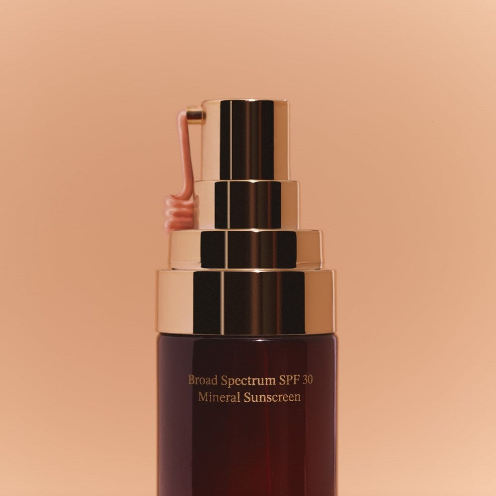 Good Weather Skin The One Daily Sun Cream Warm Glow SPF 30 (30 ml) - product shown coming out of nozzle. 