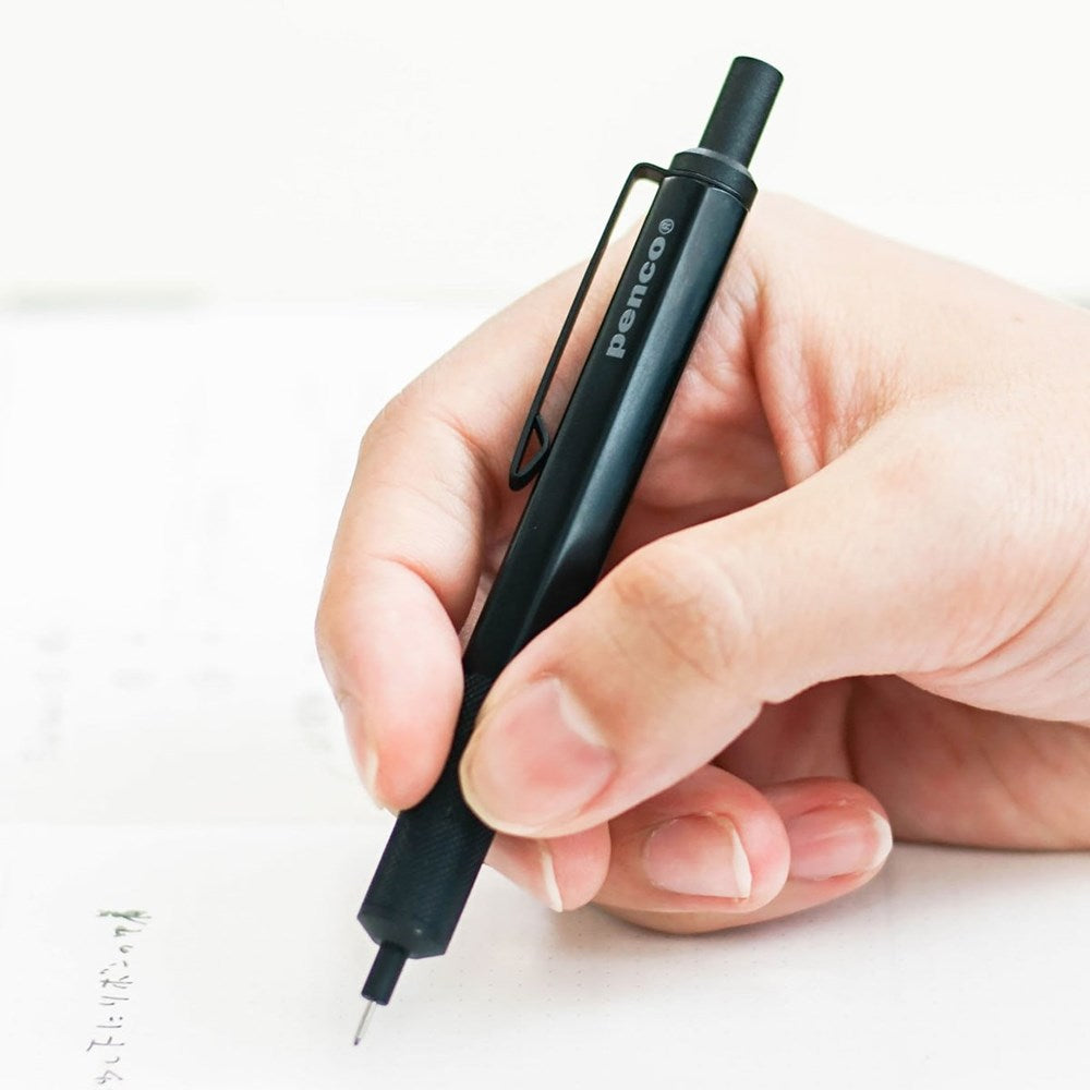 Penco Drafting Pencil - Black (1 pc) - person writing with product. 