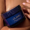 Olamic Retin-Algae Body Butter (6.7 oz) - product is being held by model. 