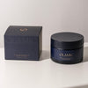 Lifestyle shot of Olamic Retin-Algae Body Butter (6.7 oz) box and jar