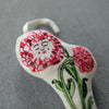 Close up of Skippy Cotton Little Poppies Token (1 pc)