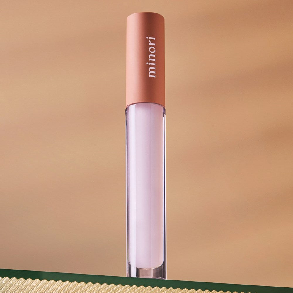 Lifestyle shot of Minori Lip Serum - Dream (3.5 ml) sitting on glass shelf