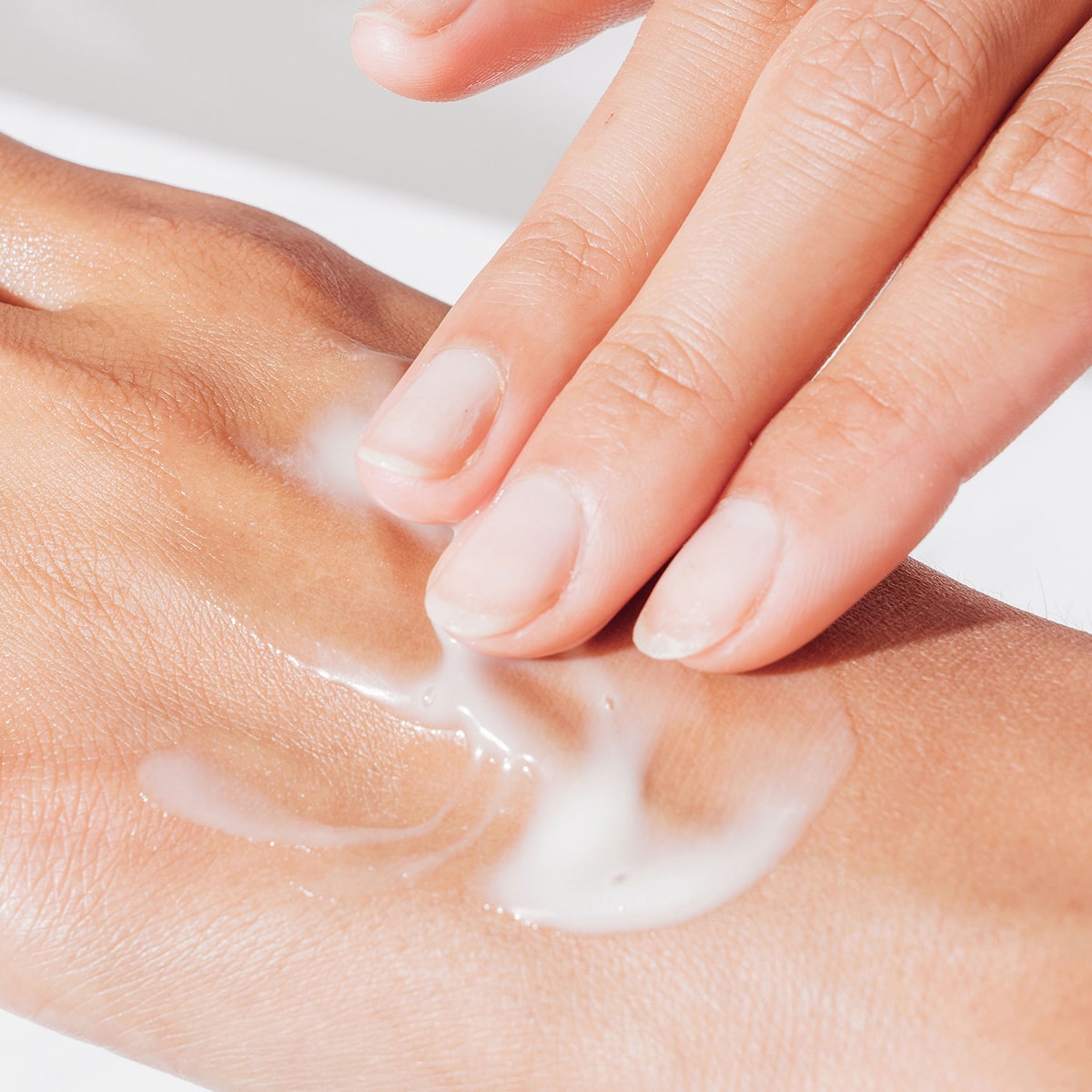 Ursa Major Fortifying Gel Moisturizer (1.7 oz) - product shown swatched on the back of a hand. 