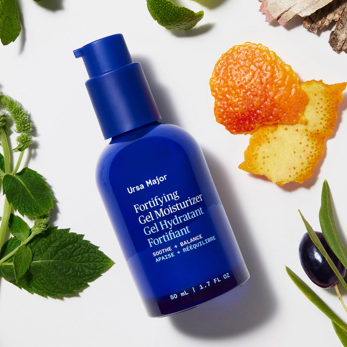 Ursa Major Fortifying Gel Moisturizer (1.7 oz) - product shown with fruit and leaves in background. 