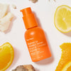 Ursa Major Brighten Up Vitamin C Serum (1 oz) - product shown next to a fruits. 