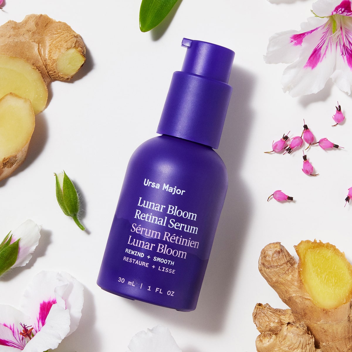 Ursa Major Lunar Bloom Retinal Serum (1 oz) - product shown next to flowers and ginger. 