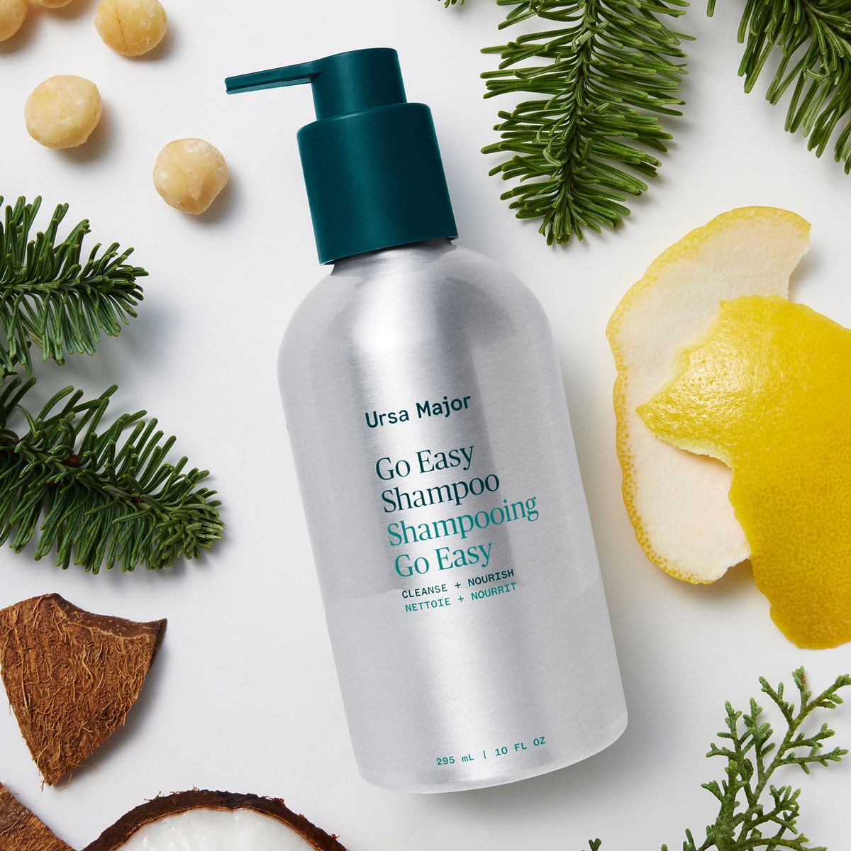 Ursa Major Go Easy Daily Shampoo (10 oz)  - product shown with fruit, nuts and plants.