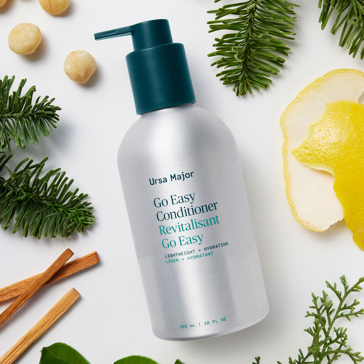 Ursa Major Go Easy Daily Conditioner (10 oz) - product shown with fruit, nuts and plants. 