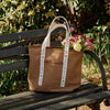 Rifle Paper Co. Ditsy Dahlia Canvas Carry All (1 pc) - product shown outside with flowers (flowers not included). 