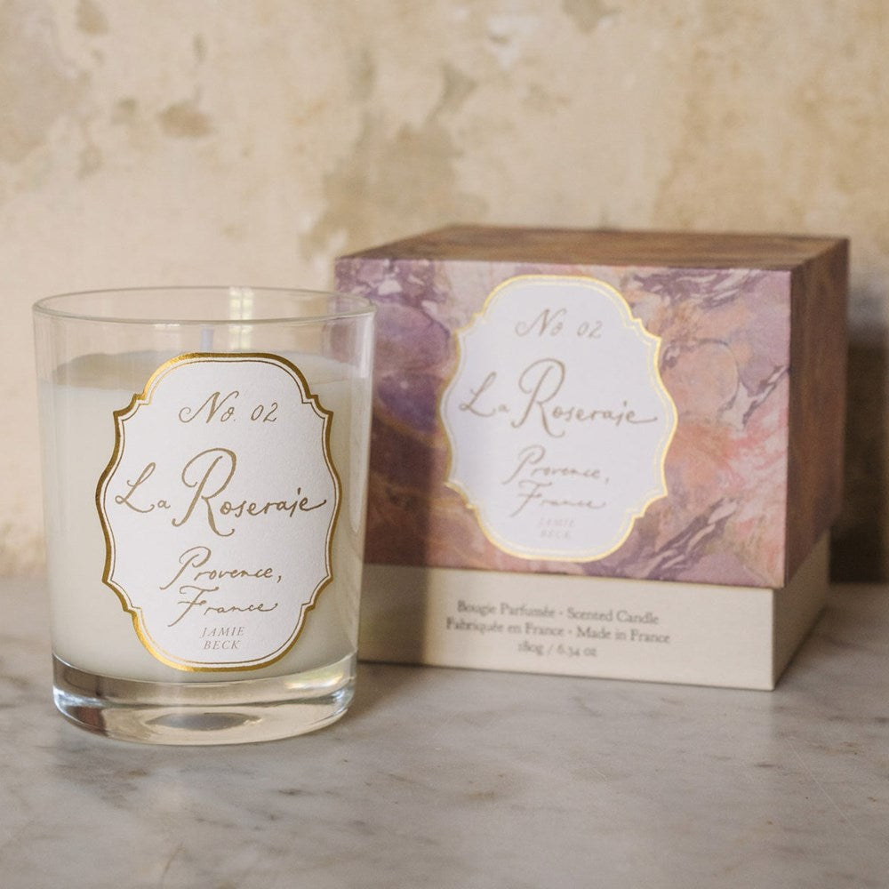 Jamie Beck La Roseraie Candle (6.34 oz) - product shown next to packaging. 