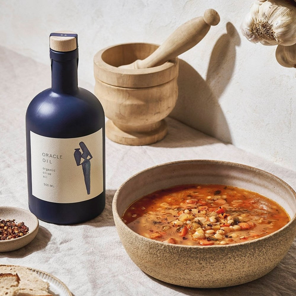Oracle Oil Olive Oil (500 ml) - product shown next to a bowl of food. 