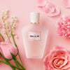 Paul & Joe Beaute Refreshing Mist 01 (80 ml) - product shown on pink background with pink flowers. 