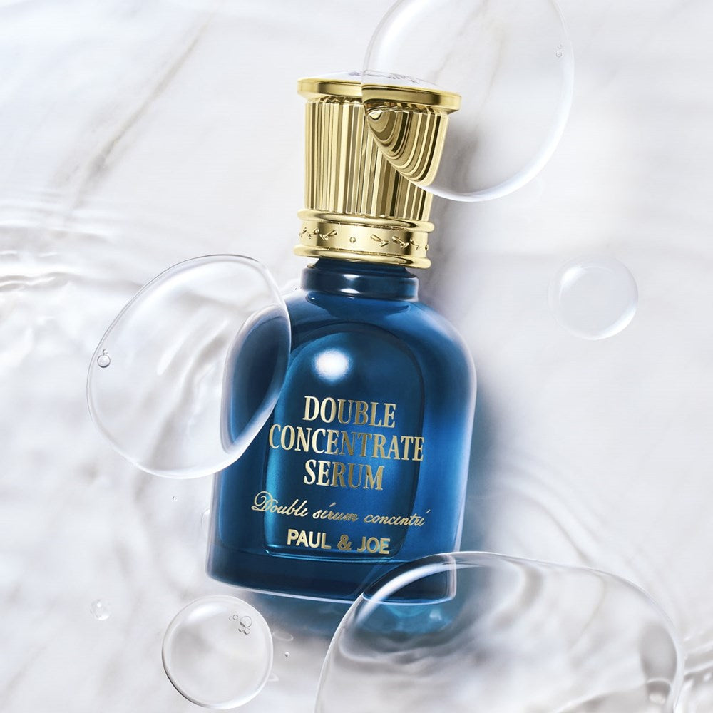 Paul & Joe Beaute Double Concentrate Serum (40 ml) - product shown with bubbles and liquid background. 