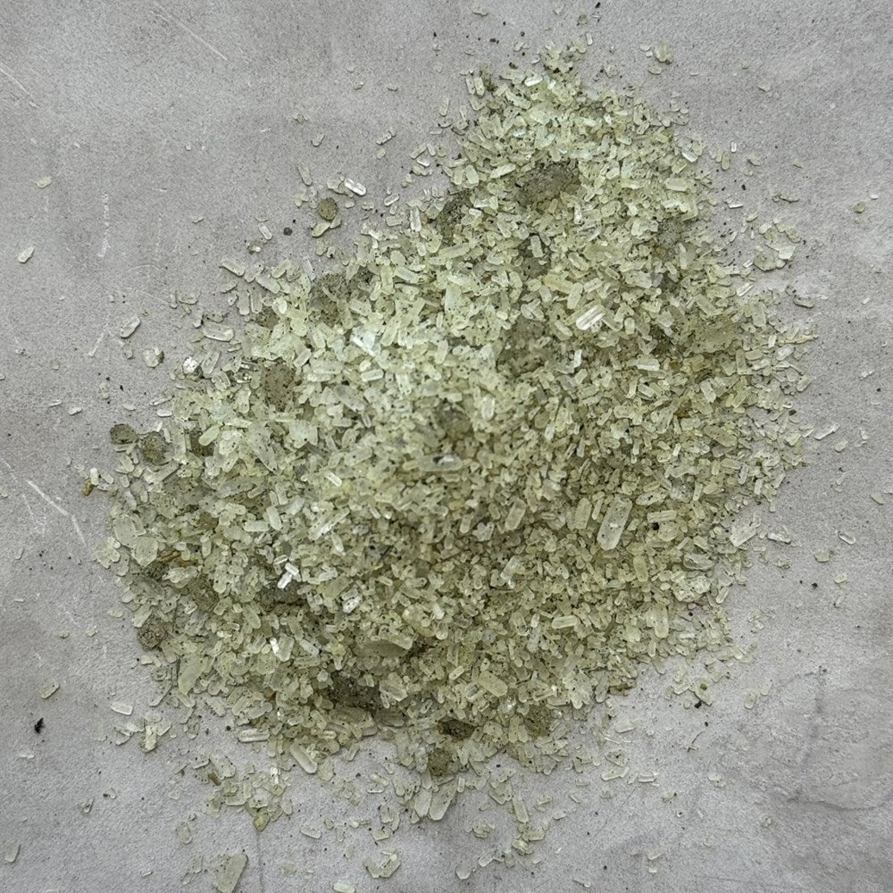 Figaro Apothecary Lush Botanical + Floating Mineral Bath Soak shown in a pile