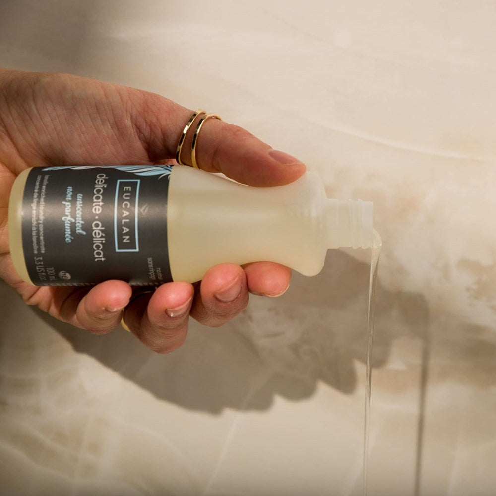 Eucalan Unscented Delicate Wash (100 ml) - product shown being poured.