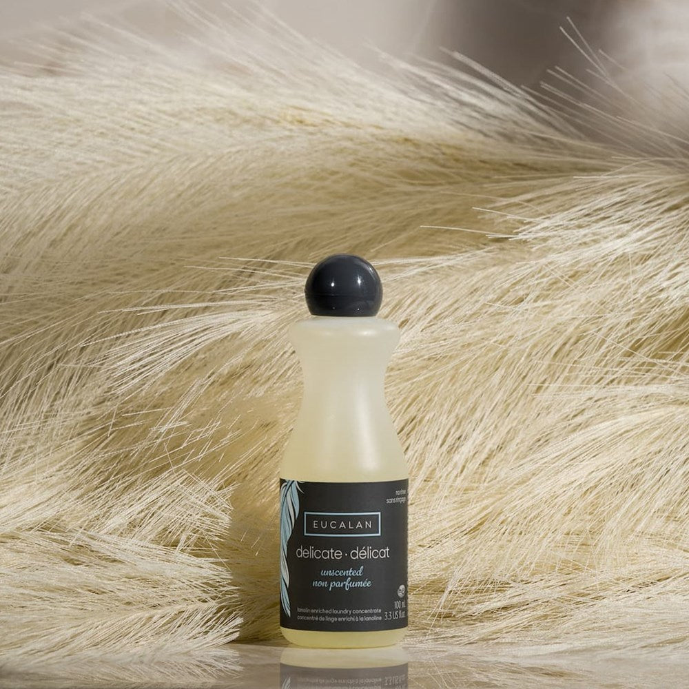 Eucalan Unscented Delicate Wash (100 ml) - product shown in front of feathers. 