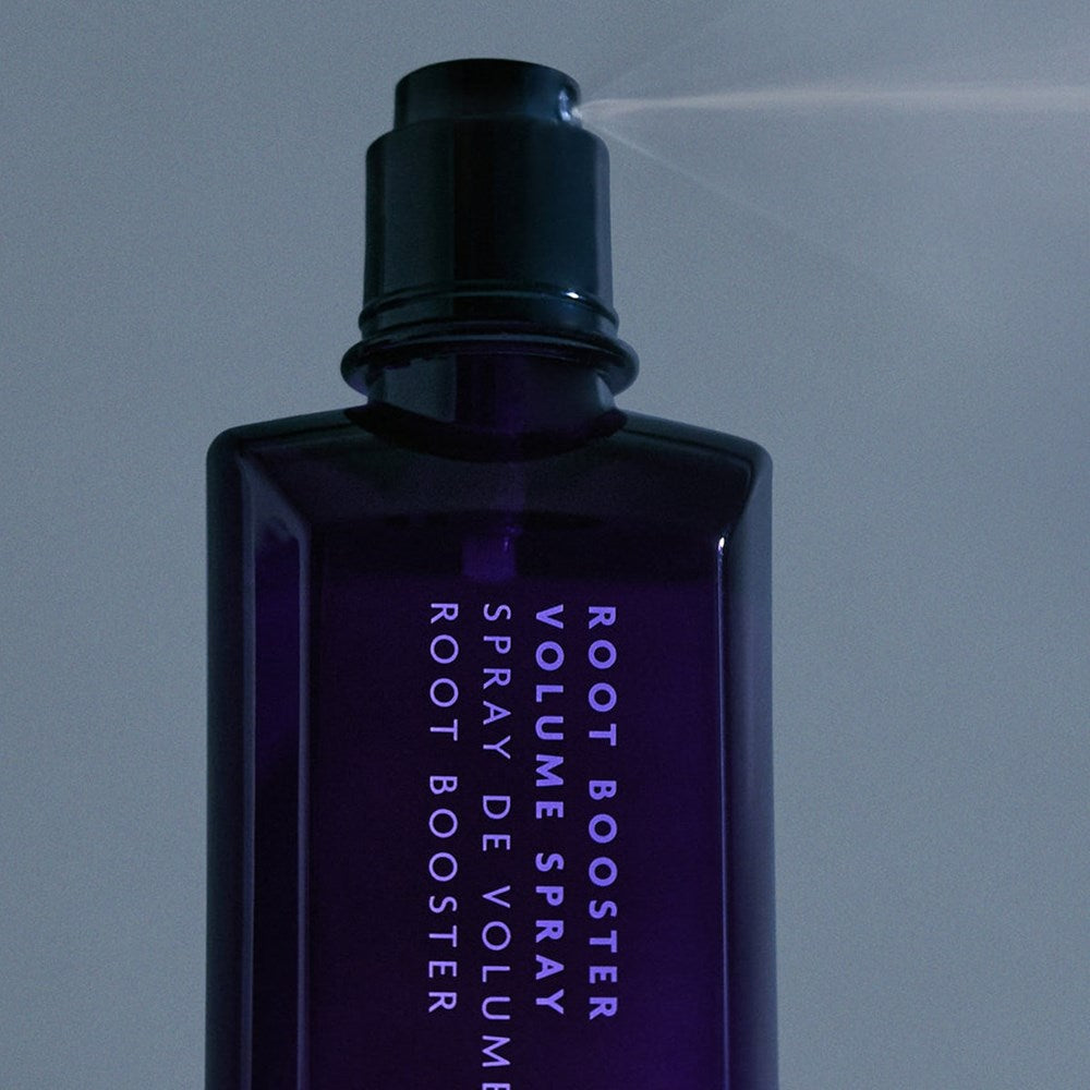 R+Co Root Booster Volume Spray (6.8 oz) -product shown being sprayed.