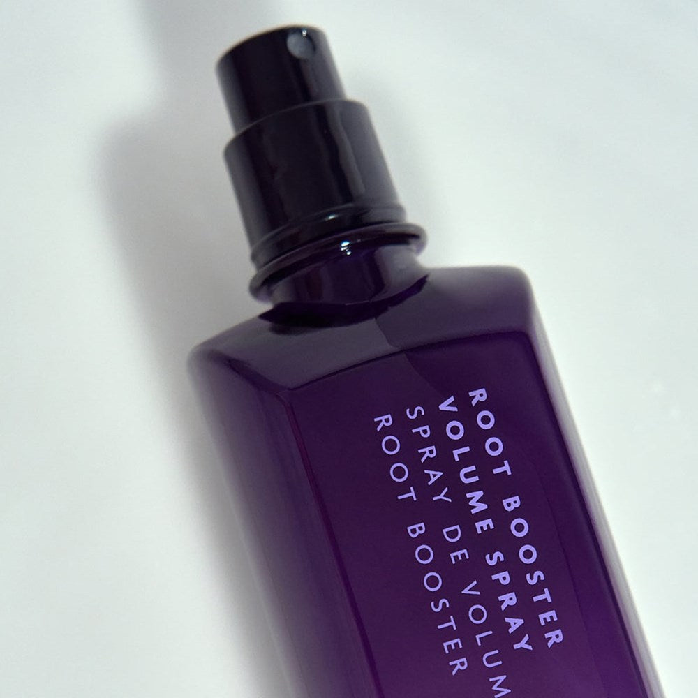 R+Co Root Booster Volume Spray (6.8 oz) - product shown laying on back. 