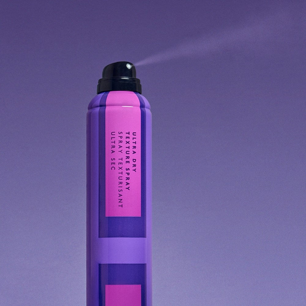 R+Co Ultra Dry Texture Spray (8 oz) - product shown being sprayed. 