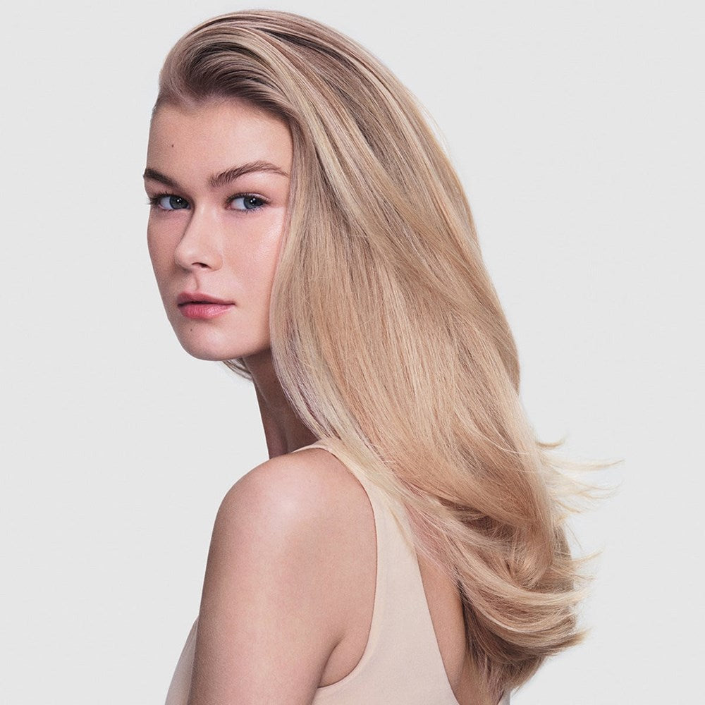 R+Co On A Cloud Repair Styling Oil (1.4 oz) - product shown on model's hair. 