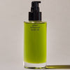 Activist A.M.S. Green Botanical Body Oil (3.4 oz) - product shown with cap removed. 