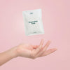 Mother Mother Magnesium Bath Soak – Single Soak (3 oz) - product shown in air on pink background. 