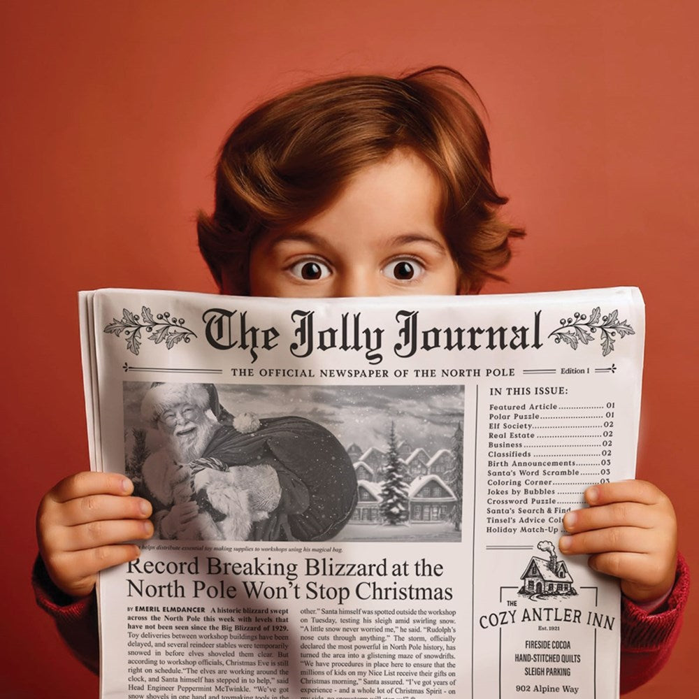Inklings Paperie The Jolly Journal Newspaper Gift Wrap (4 pcs) - product shown being held by child. 