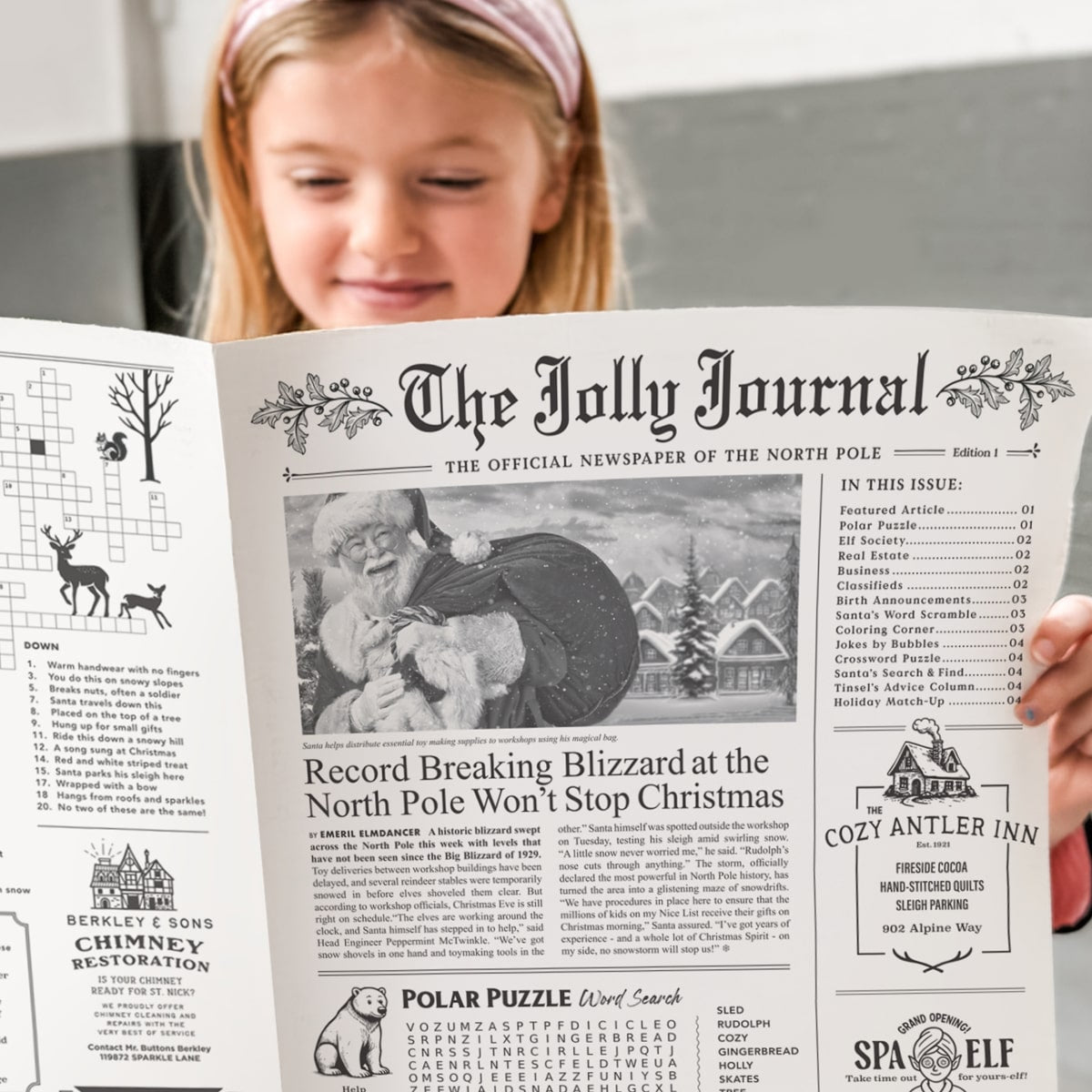 Inklings Paperie The Jolly Journal Newspaper Gift Wrap (4 pcs) - product shown being held by child. 