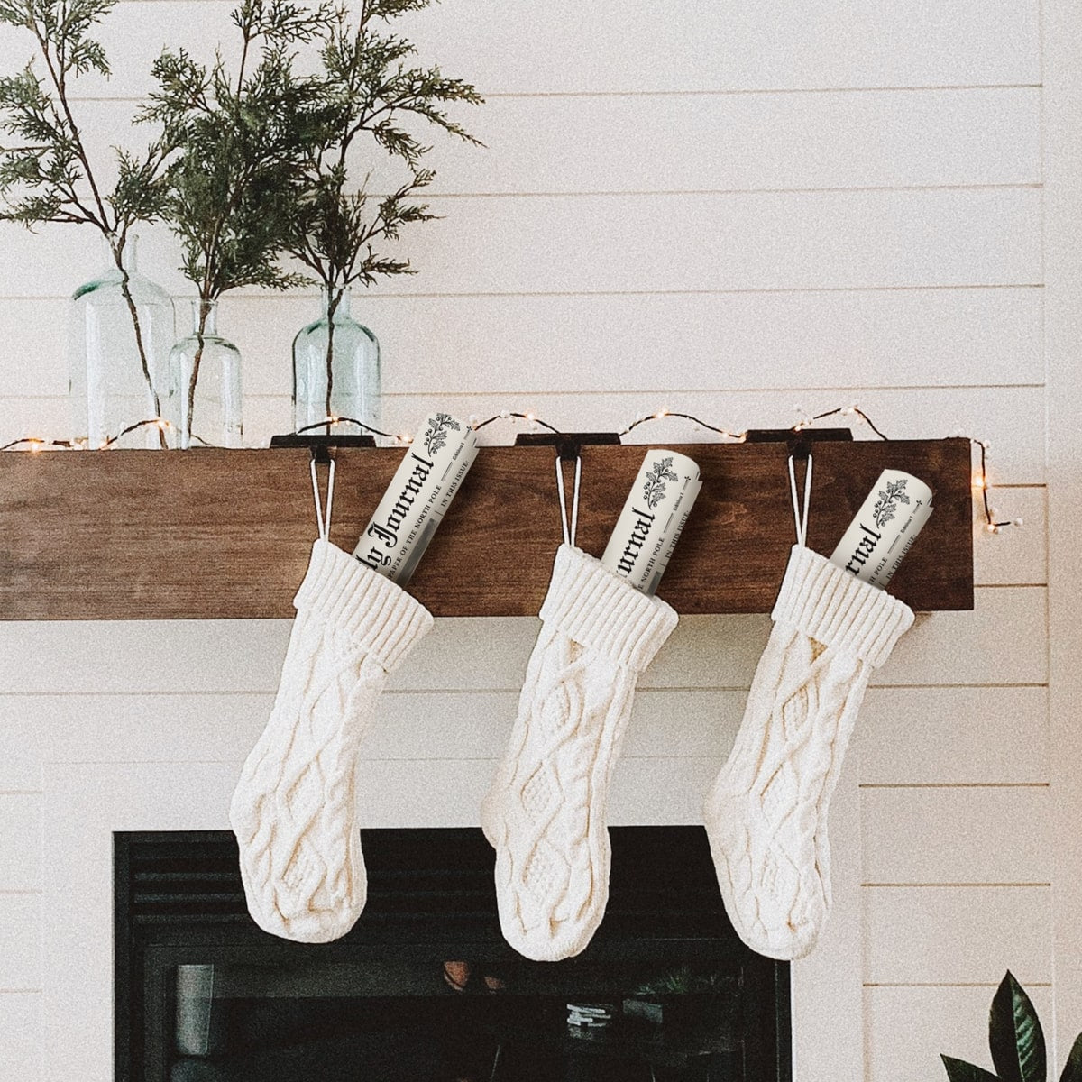 Inklings Paperie The Jolly Journal Newspaper Gift Wrap (4 pcs) - product shown hanging out of stockings. 