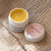 Minois Paris Magic Balm (50 ml) - product shown open on blanket. 