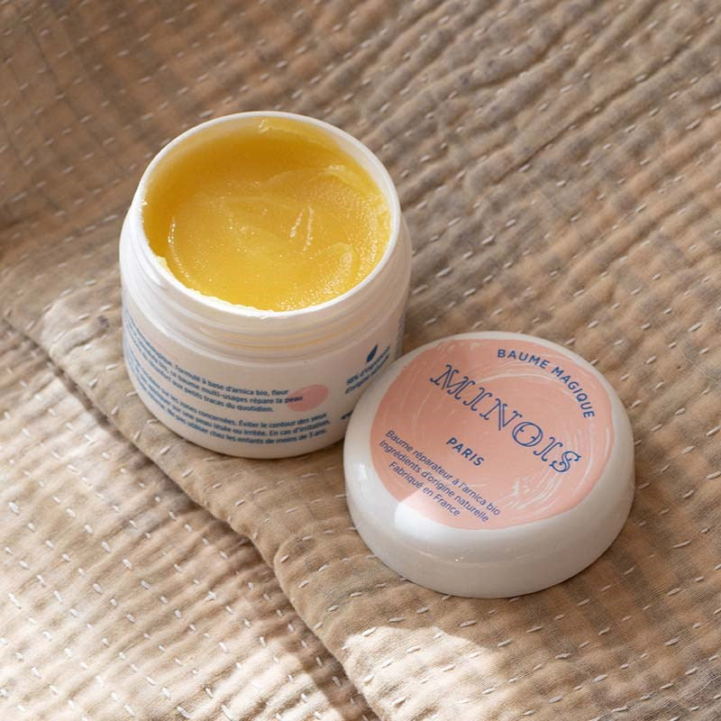 Minois Paris Magic Balm (50 ml) - product shown open on blanket. 