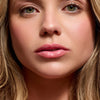 Cote The Necessity Peptide Lip Shine - Branson (3.5 ml) -product shown on model. 