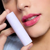 Cote The Necessity Peptide Lip Shine - Lola (3.5 ml) - product shown on model. 
