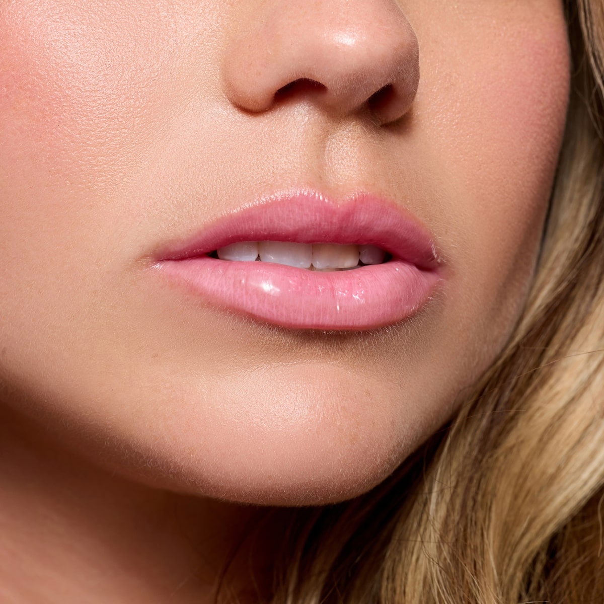 Cote The Necessity Peptide Lip Shine - Lyla (3.5 ml)  - product shown on model.