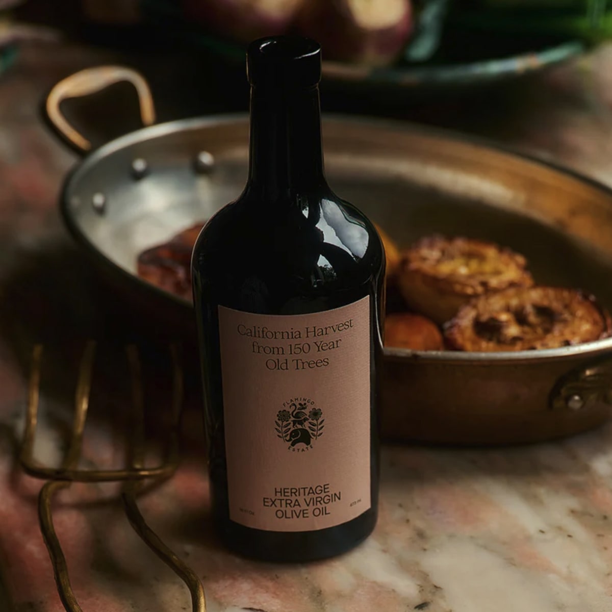 Flamingo Estate Organics Olive Oil and Fuyu Persimmon Vinegar Gift Box Set (2 pcs) - product shown in front of cooking pan. 