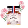 Les Abeilles de Malescot Rose Petal Infused Honey (125 g) - product shown with drawn roses in the background. 
