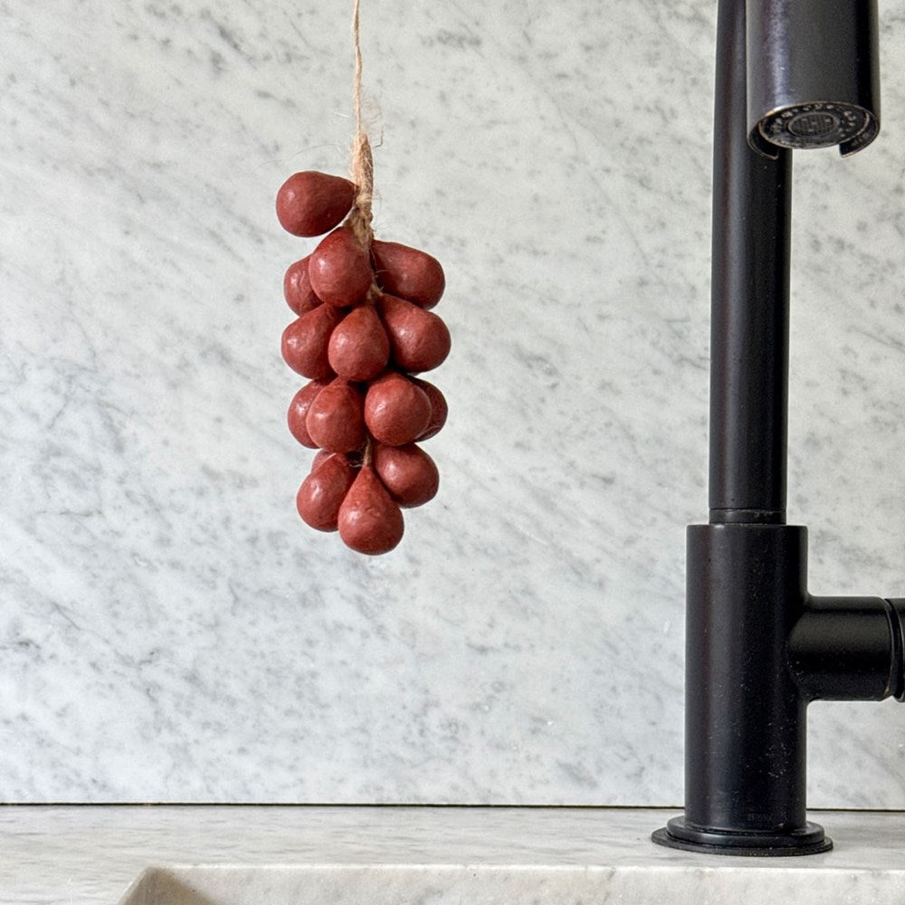 Botanopia Handcrafted Grapes Soap - Wine (100 g) - product shown next to a kitchen sink. 
