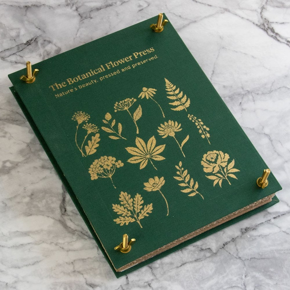 Botanopia The Botanical Flower Press - Linen Cover & Gold Foil (1 kit) - product shown on marble counter. 