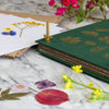 Botanopia The Botanical Flower Press - Linen Cover & Gold Foil (1 kit) = product shown on counter with flower petals.